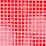 A grid of square tiles in various shades of red with some tiles exhibiting a glossy finish and light reflections. The arrangement of the tiles is somewhat irregular with a noticeable pattern disruption in some areas.