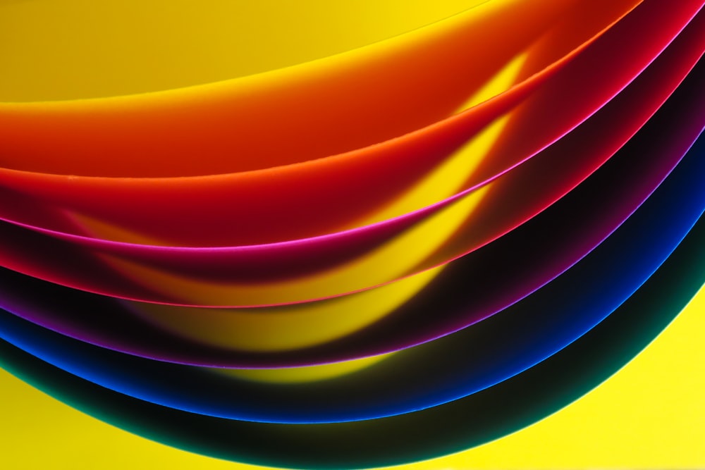 yellow, red, purple, blue, and green layer paper wallpaper