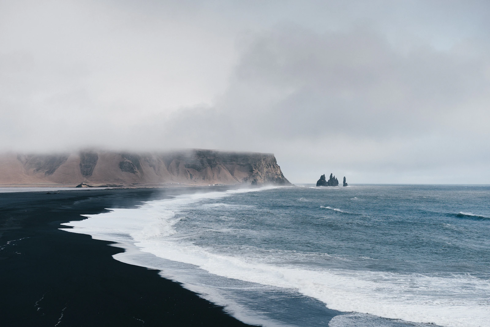Private luxury travel Faroe Islands dramatic cliffs Atlantic remote Nordic experience