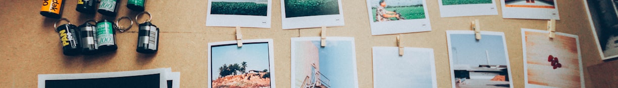 assorted photos on beige wooden table