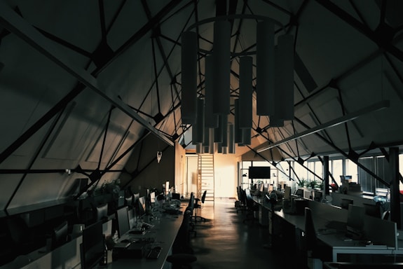 A modern office space with bright lighting fixtures showcasing various styles and designs.