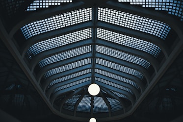 low angle photography of mesh wall
