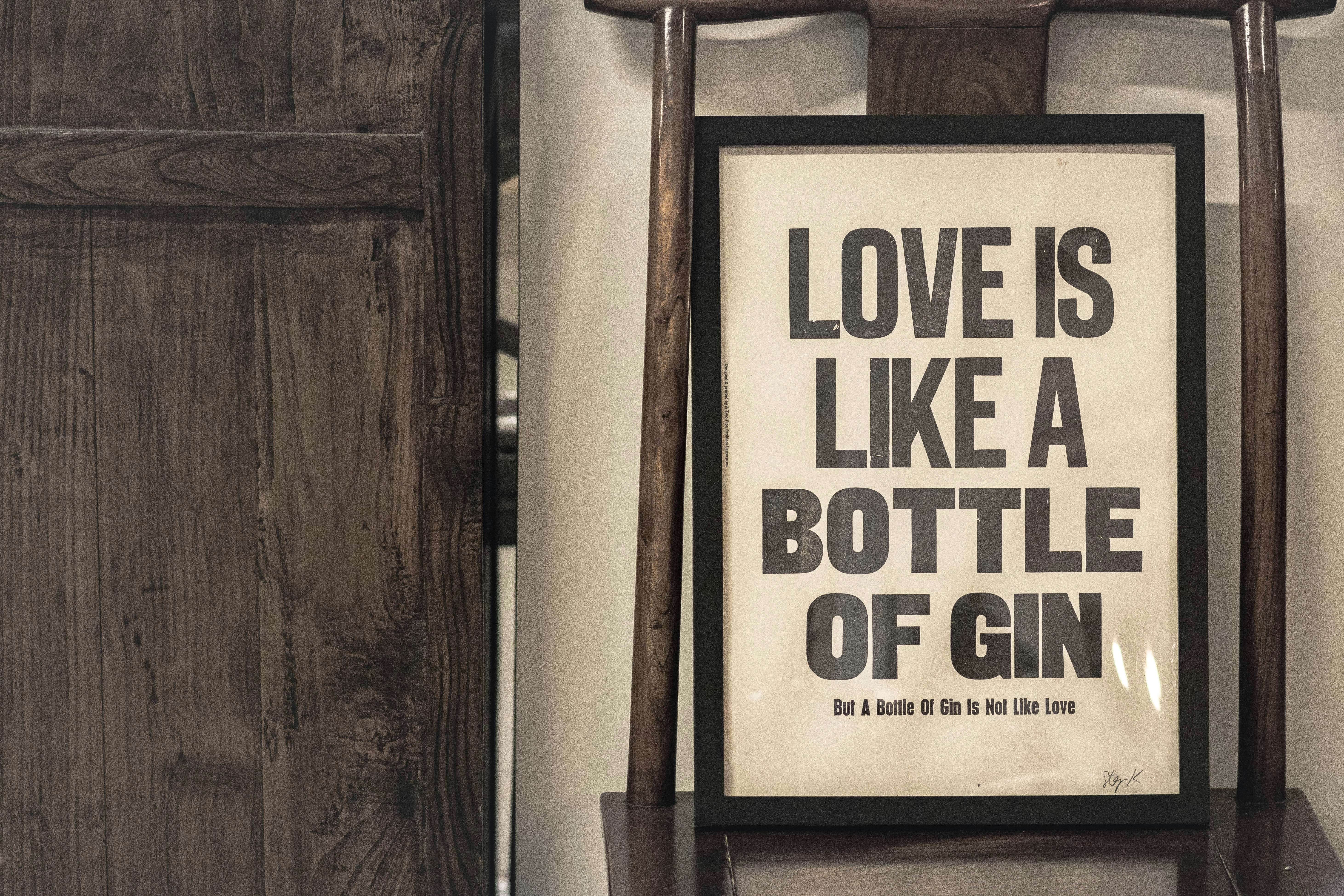 love is like a bottle of gin signage
