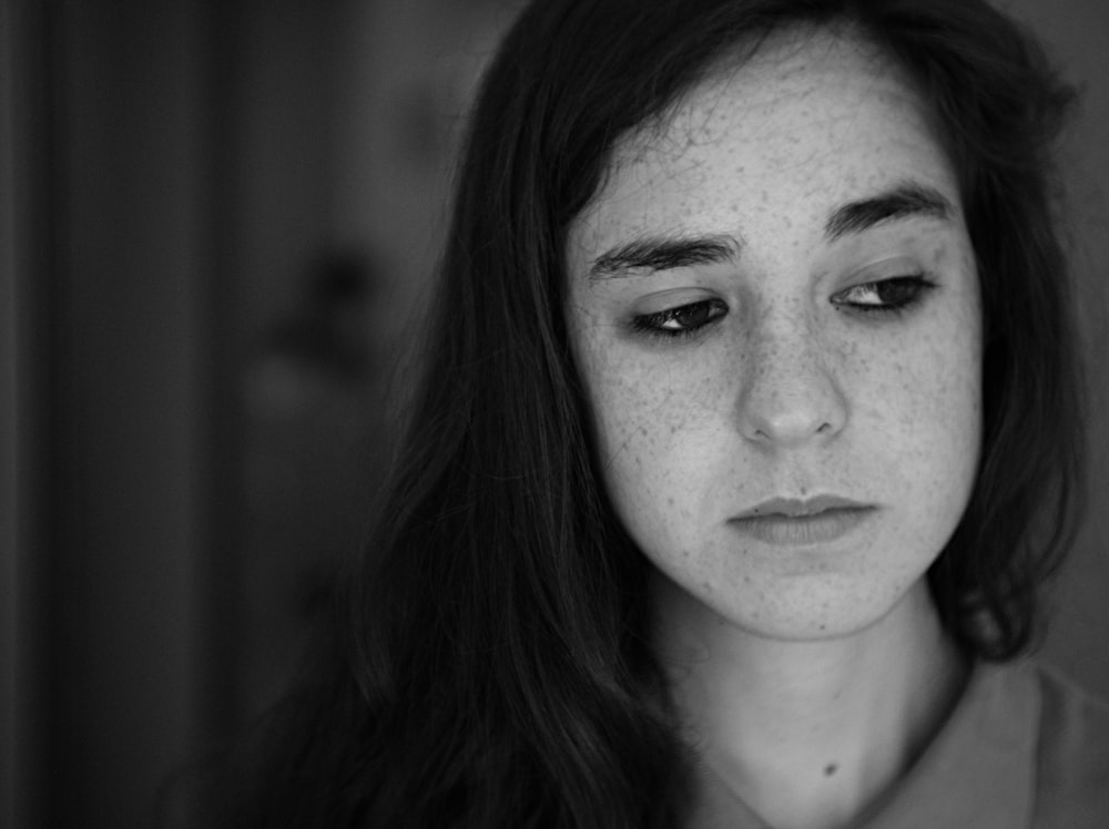 grayscale photo of woman wearing collared shirt