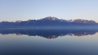 rock mountains near sea at daytime