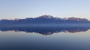 rock mountains near sea at daytime