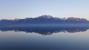 rock mountains near sea at daytime