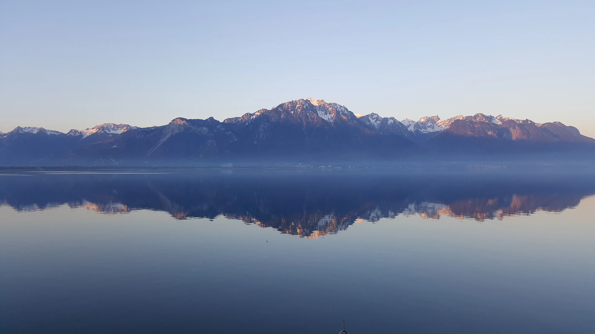 rock mountains near sea at daytime