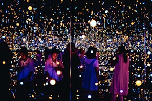 Visitors engaging with an interactive light and sound exhibit at musée moed