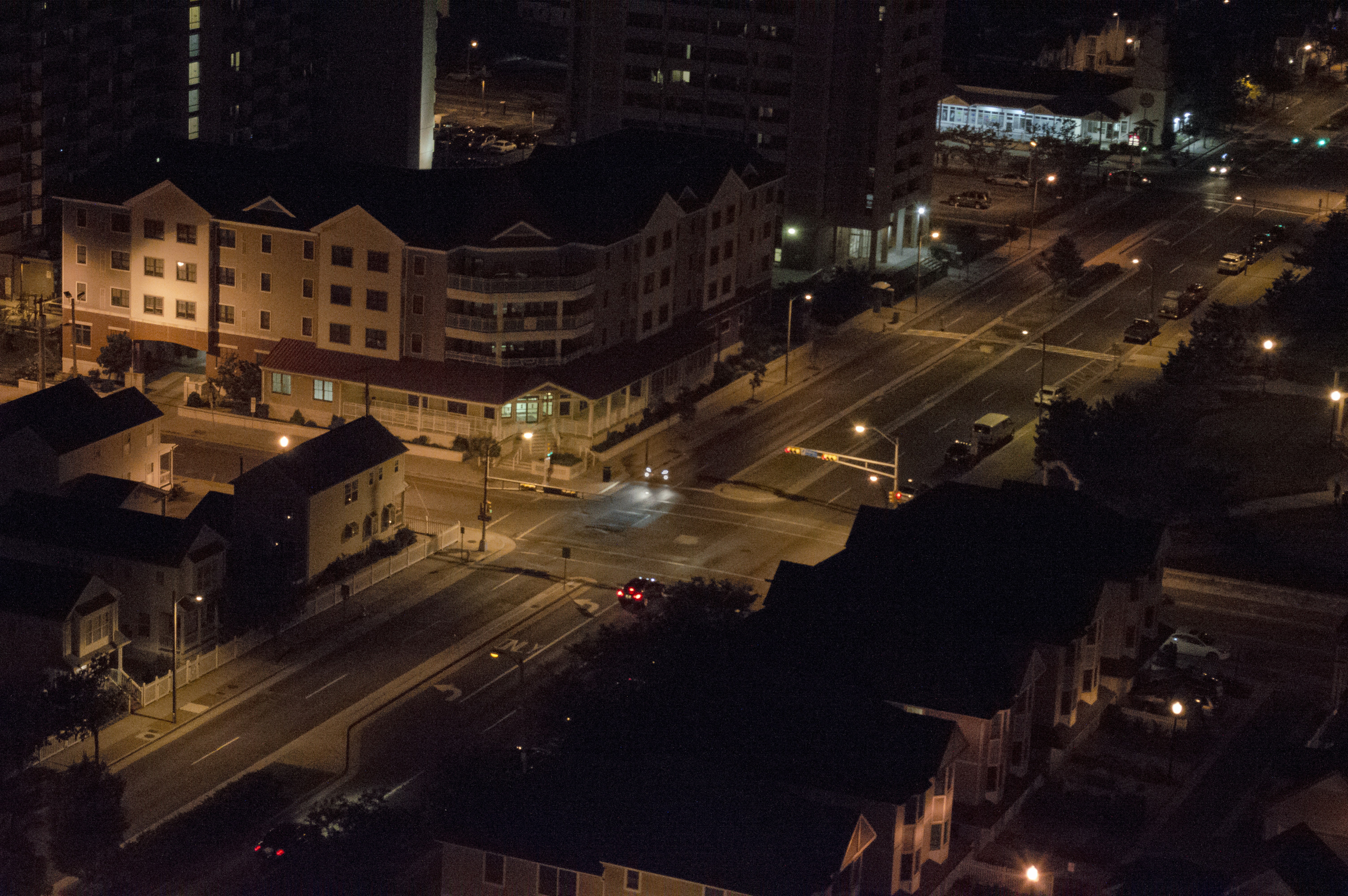 Evening view of the industrial zone with illuminated buildings and smooth traffic flow.