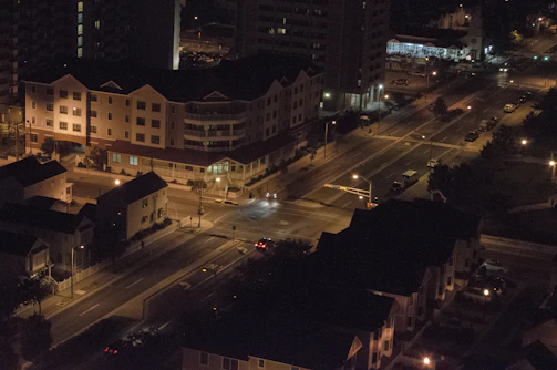 Night view of a high-end commercial complex with warm lighting.