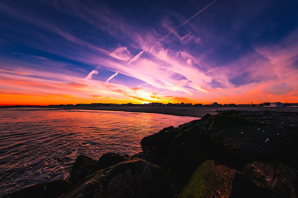 body of water and rock photo