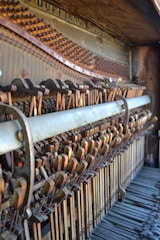 Technician repairing the internal mechanics of a piano