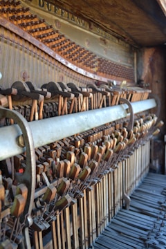 Technician repairing the internal mechanics of a piano