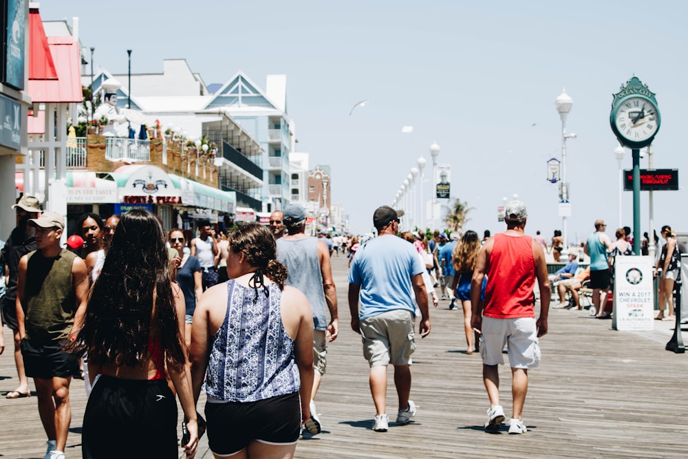 group of people walking on street during daytime