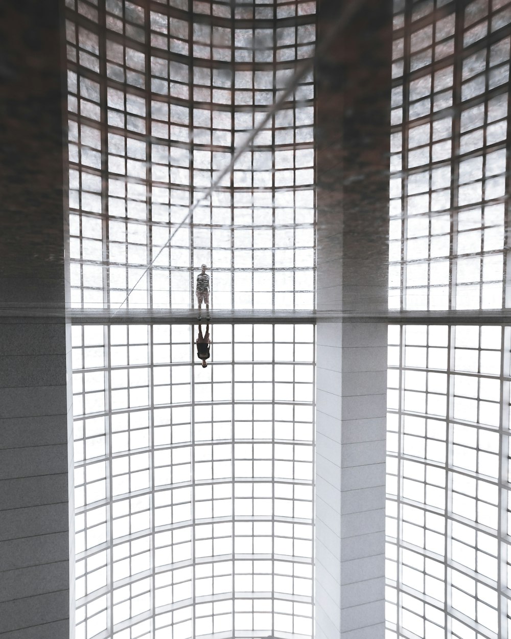 person standing inside concrete building