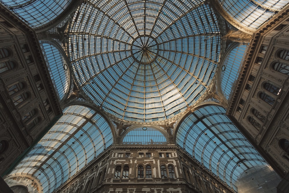 the ceiling of a building with many windows