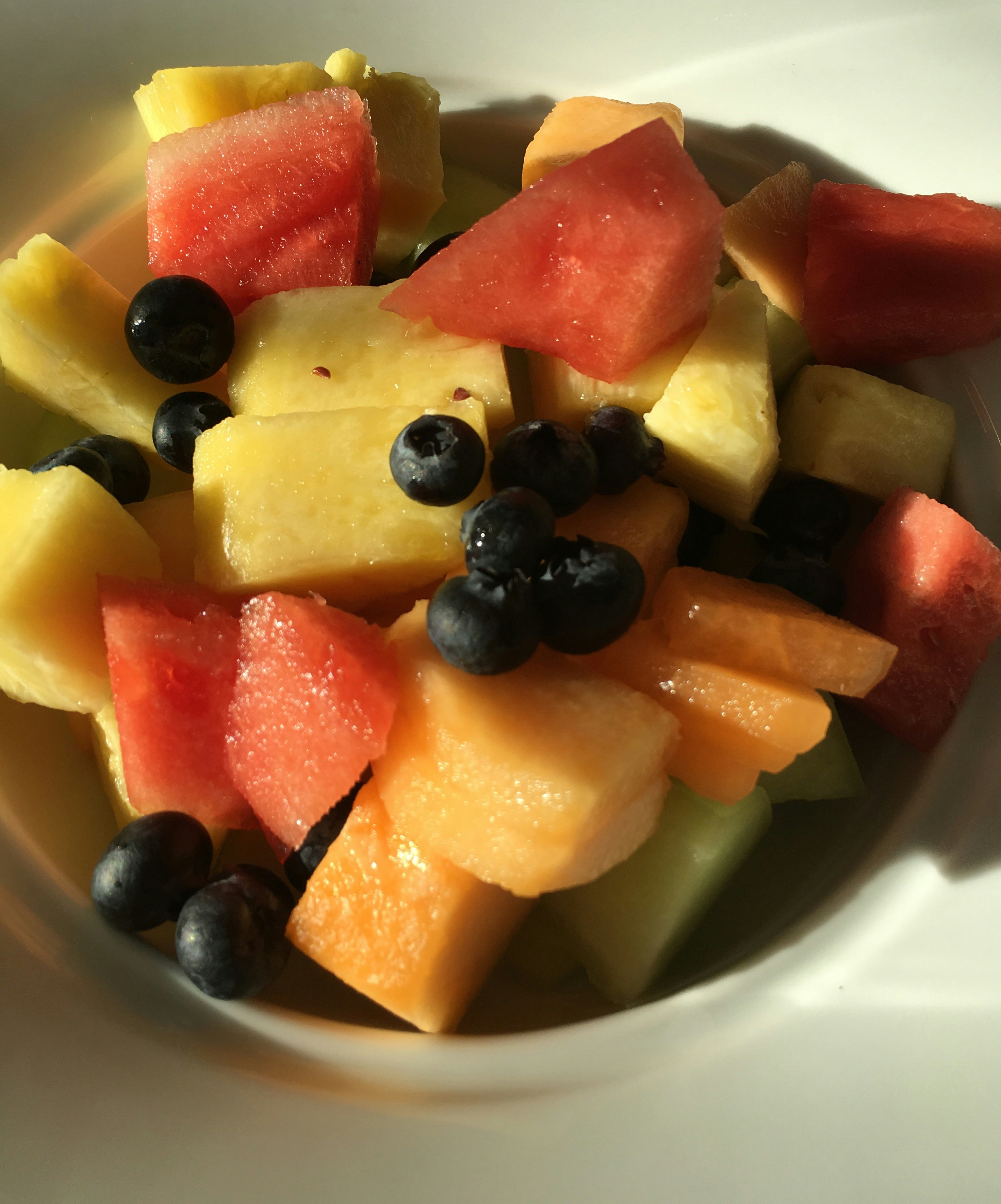Fresh-cut melon medley with watermelon, cantaloupe, and honeydew cubes in a large eco box