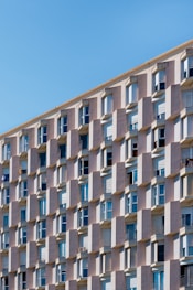 low angle photo of gray concrete building