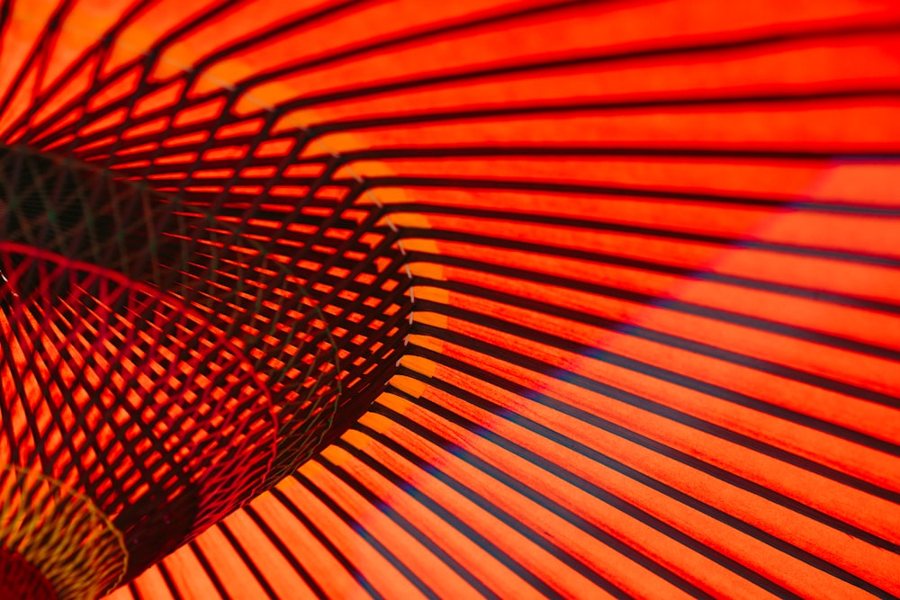 An abstract photo of orange neon lines and rails along the walls in an Asakusa building