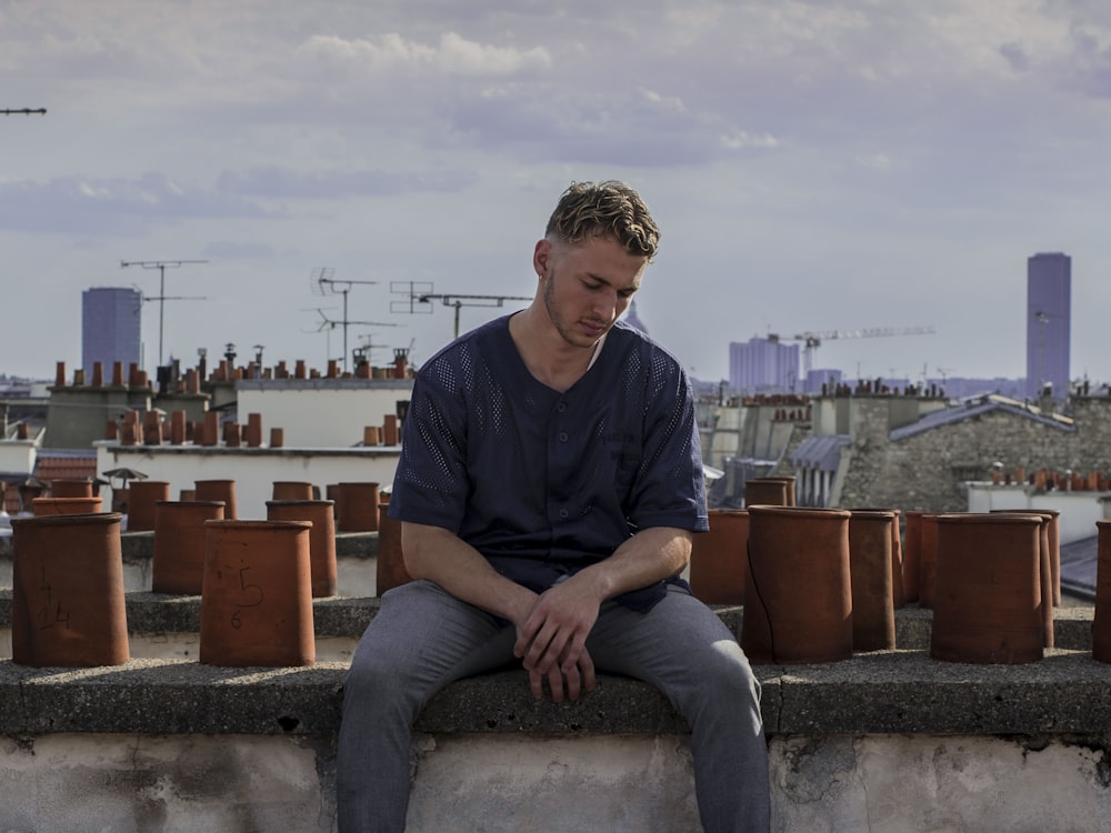 man sitting on roof deck