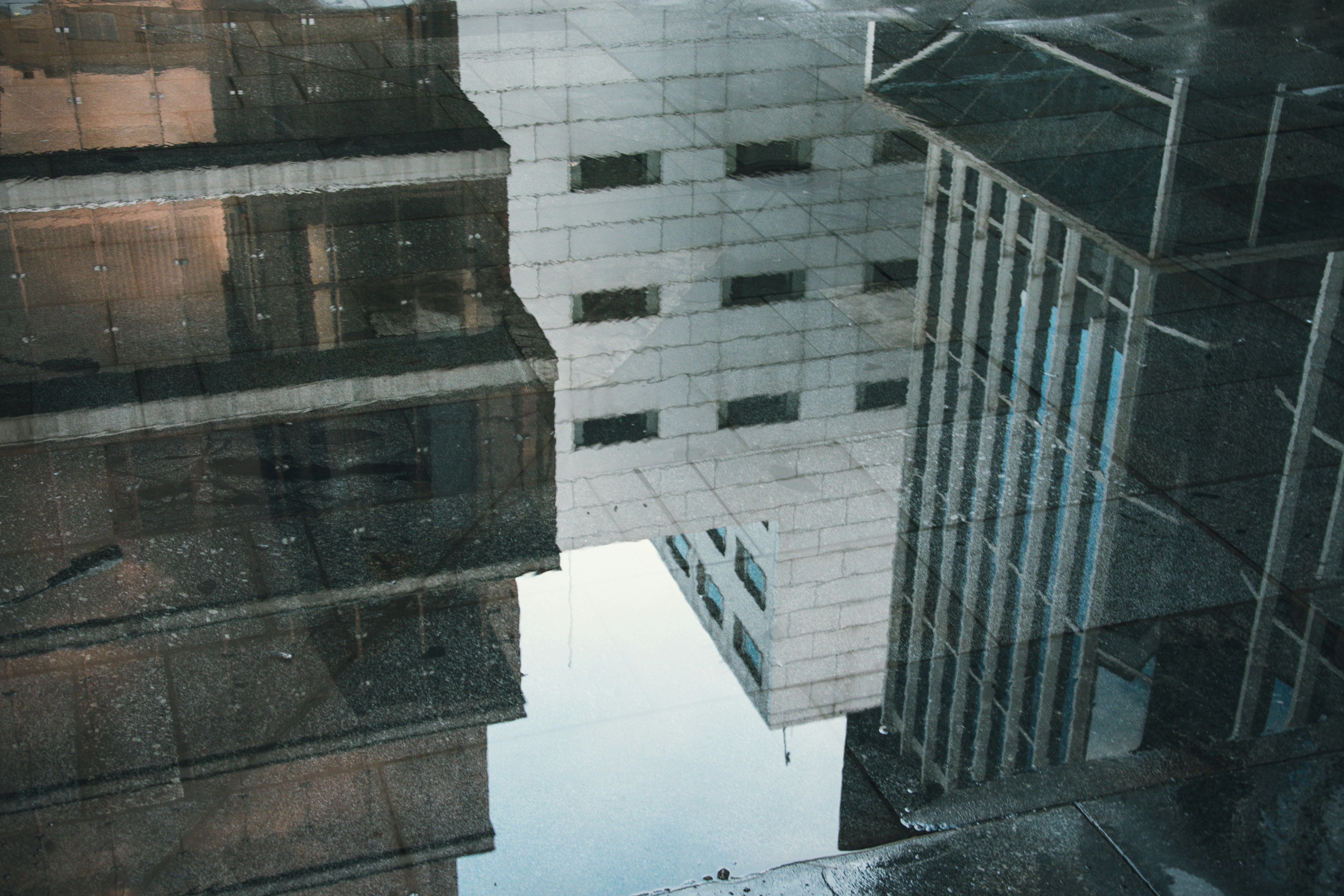 reflection of buildings in water on floor