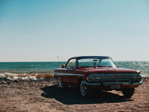 black and grey coupe parked near seashore during daytime
