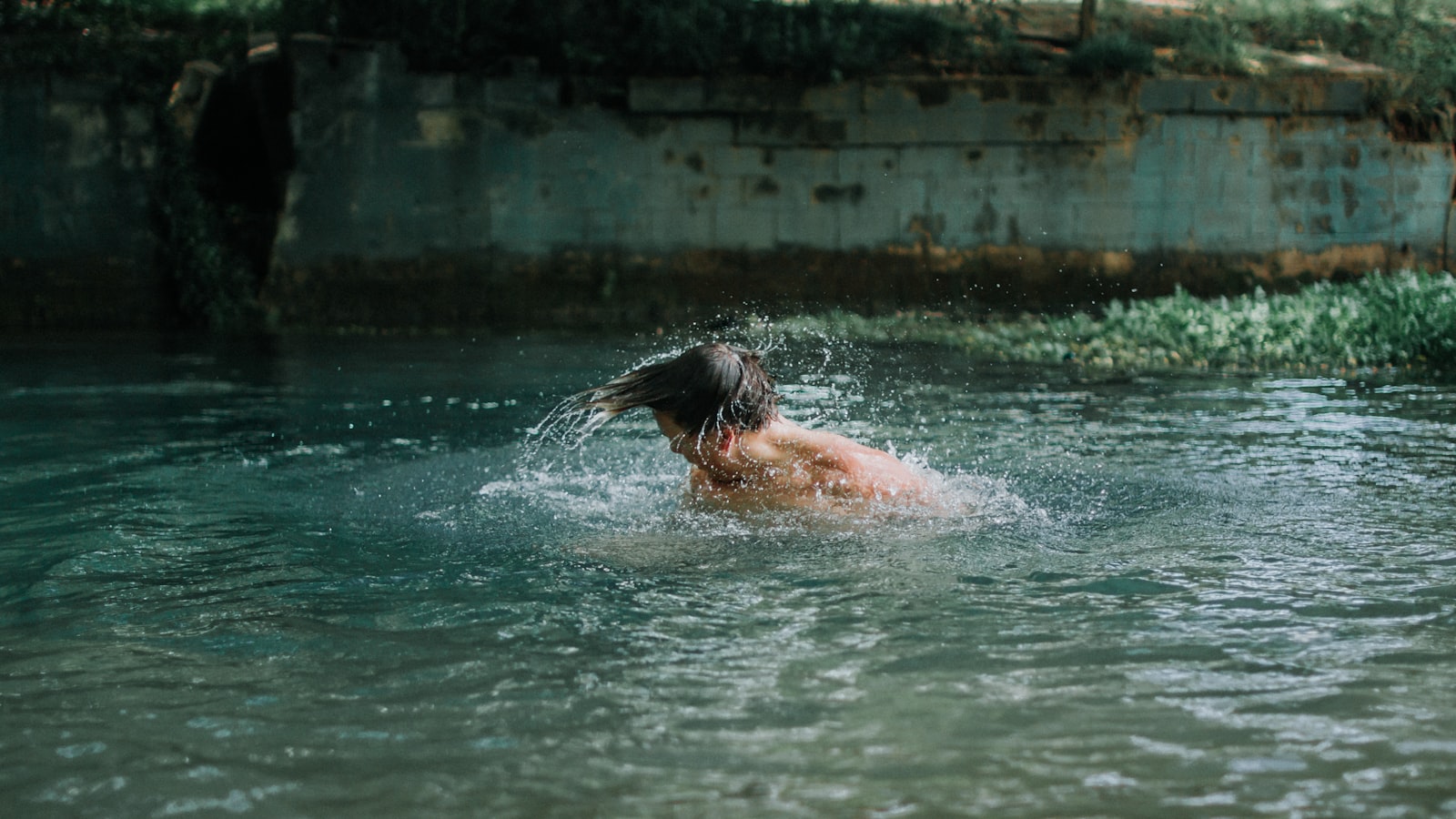 Canon EOS 60D + Sigma 30mm F1.4 EX DC HSM sample photo. Man swimming on water photography