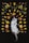 silver tabby cat surrounded by leaves