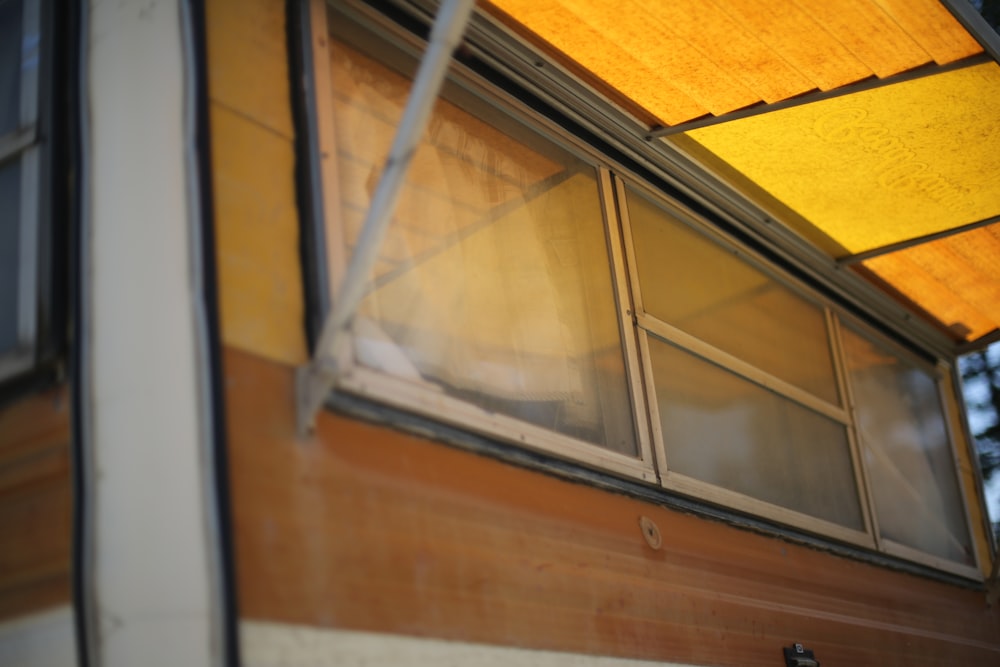 brown and white concession trailer showing clear glass window