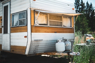 white and gray propane gas tanks on RV trailer