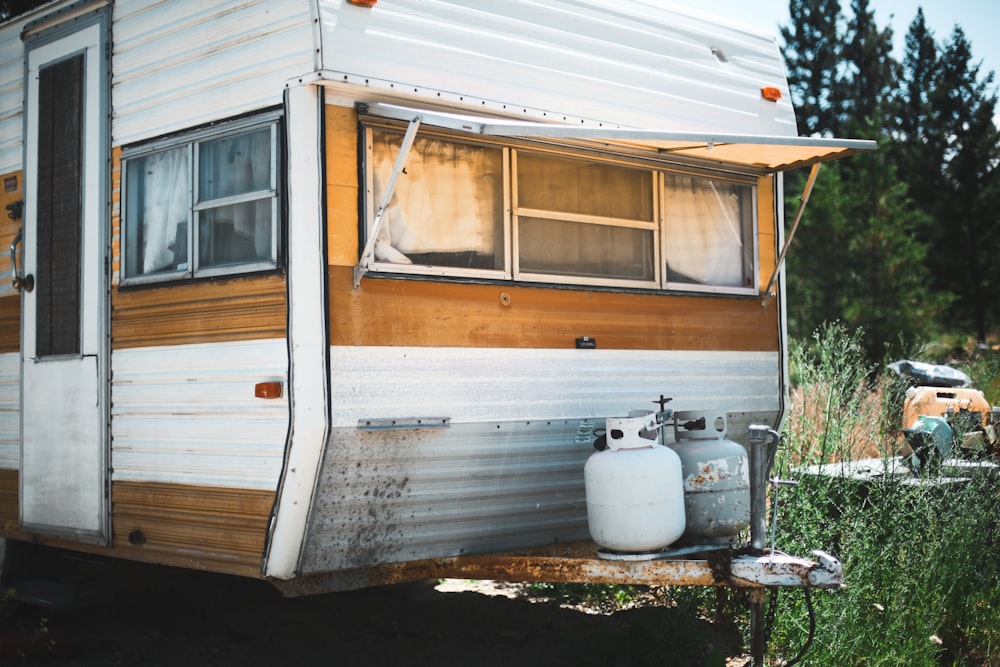 white and gray propane gas tanks on RV trailer