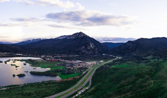 landscape photo of mountains under cloudy sky in Frisco United States