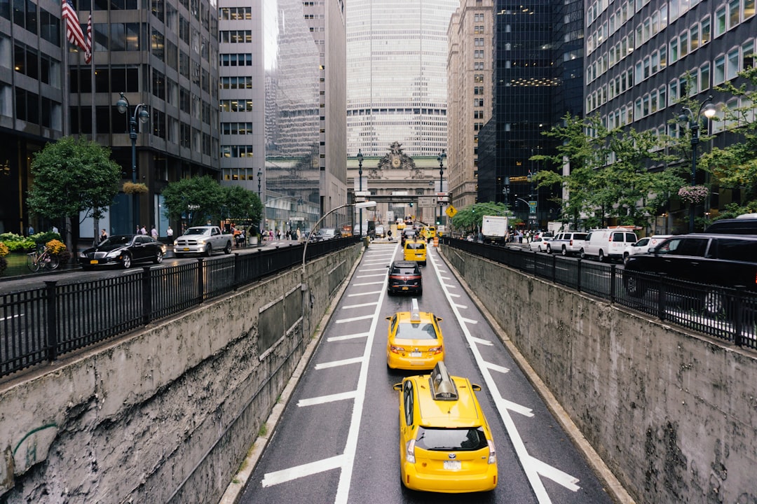 vehicles on road near buildings, Taxi Traffic