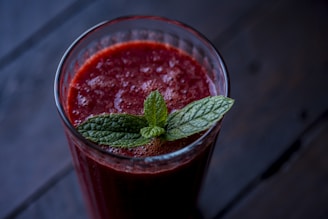 red drink in clear glass