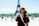 woman standing behind Eiffel Tower during daytime