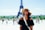 woman standing behind Eiffel Tower during daytime