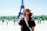 woman standing behind Eiffel Tower during daytime