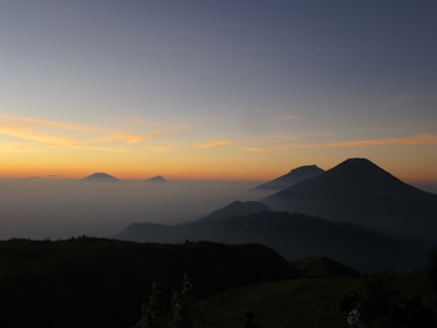 A serene dawn over Kedarnath temple framed by misty Himalayan peaks.