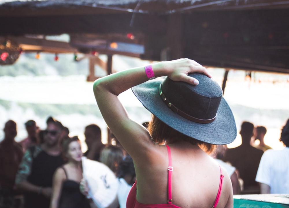 woman wearing black fedora hat