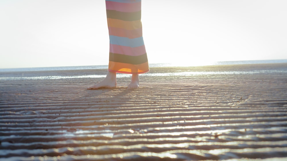 shallow focus photo of person standing on shore
