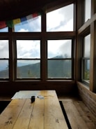 A hand-drawn map spread across a wooden table with miniature figures placed on key locations.