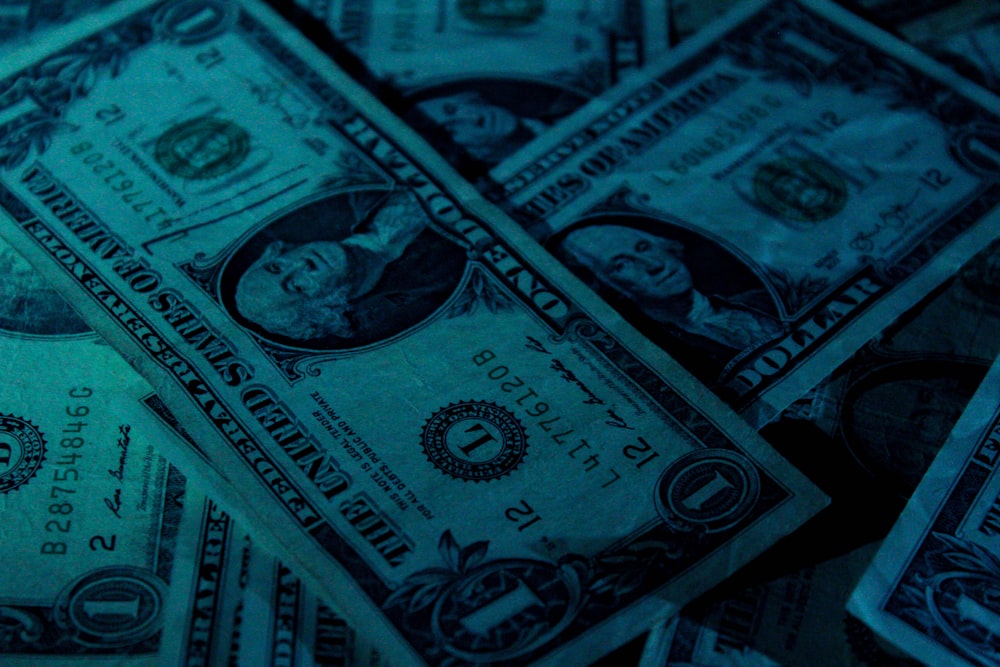 The American one dollar notes under low lighting.
