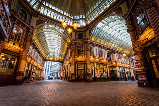 yellow and brown concrete building interior in Leadenhall Market United Kingdom
