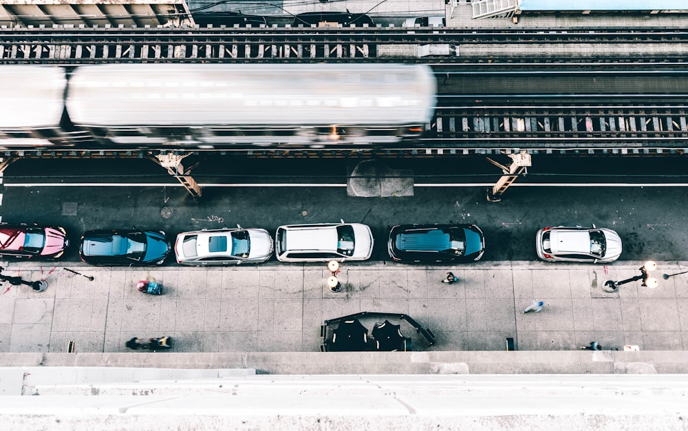 flat lay photography of cars parked beside building