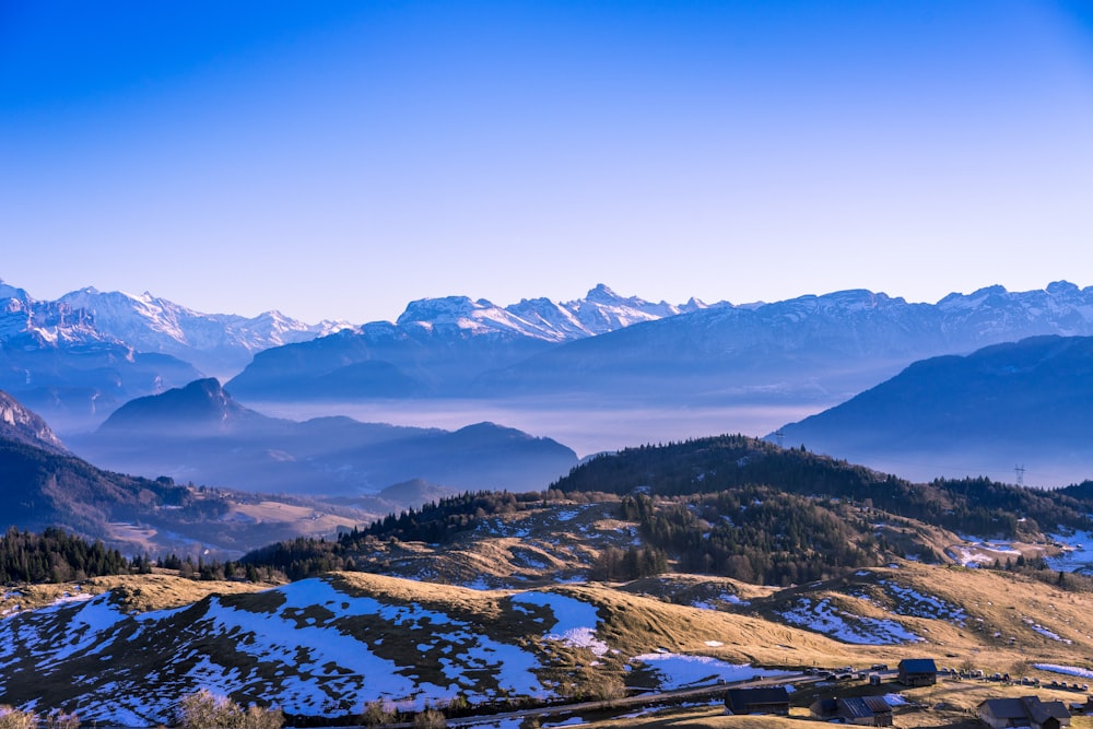 brown mountain under clear blue sky