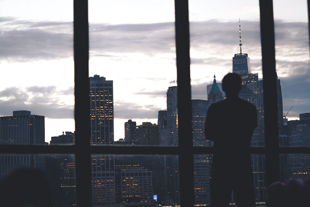 man standing near window