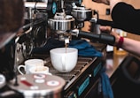 A close-up of a barista skillfully preparing a coffee drink.