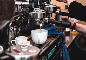 A close-up of a barista skillfully preparing a coffee drink.