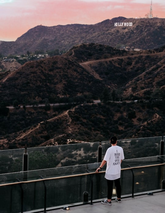 man standing watching mountain during daytime in Griffith Park United States